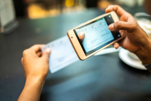 Smart phone taking a picture of a paycheck for a mobile deposit