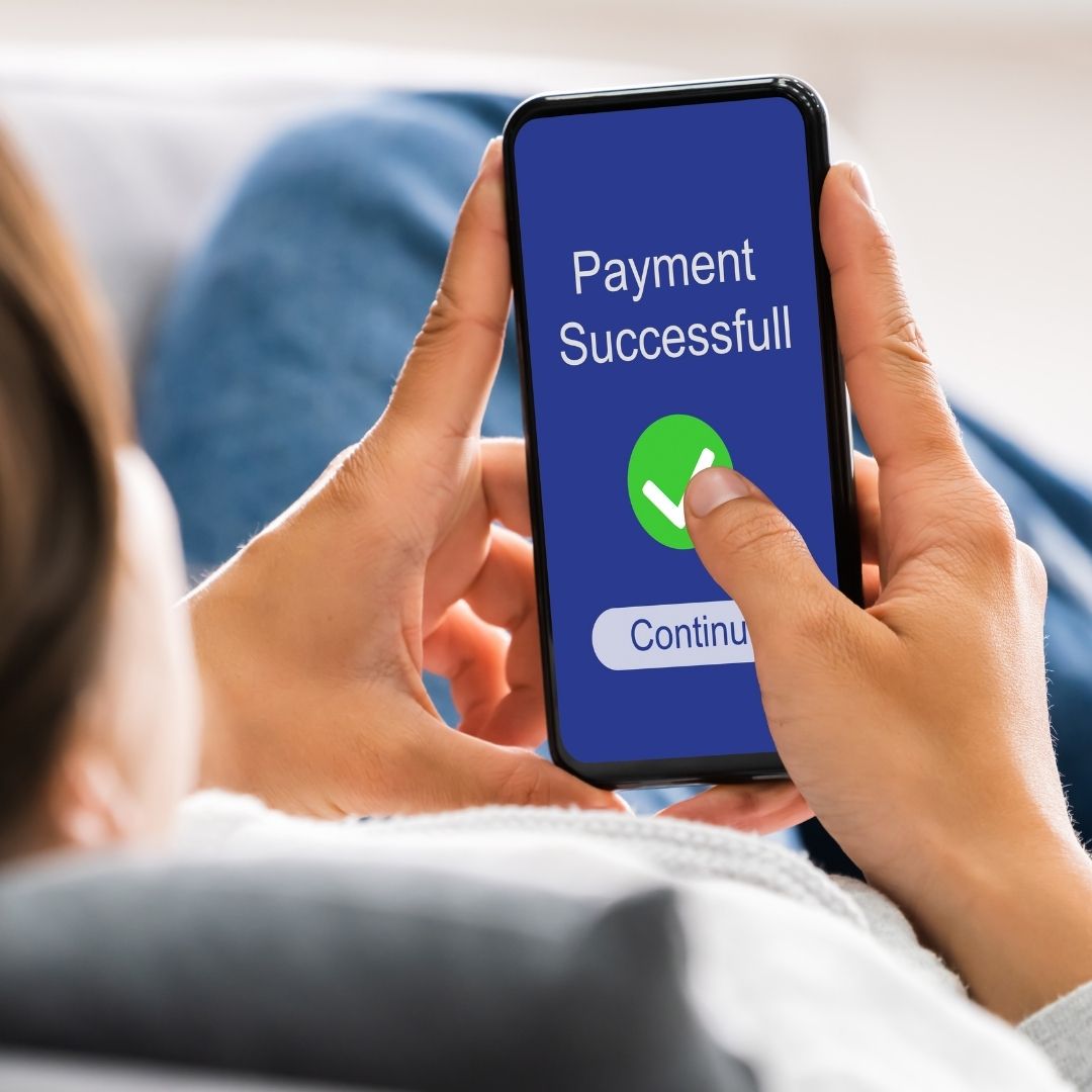 Phone screen showing 'Payment Successful' confirmation